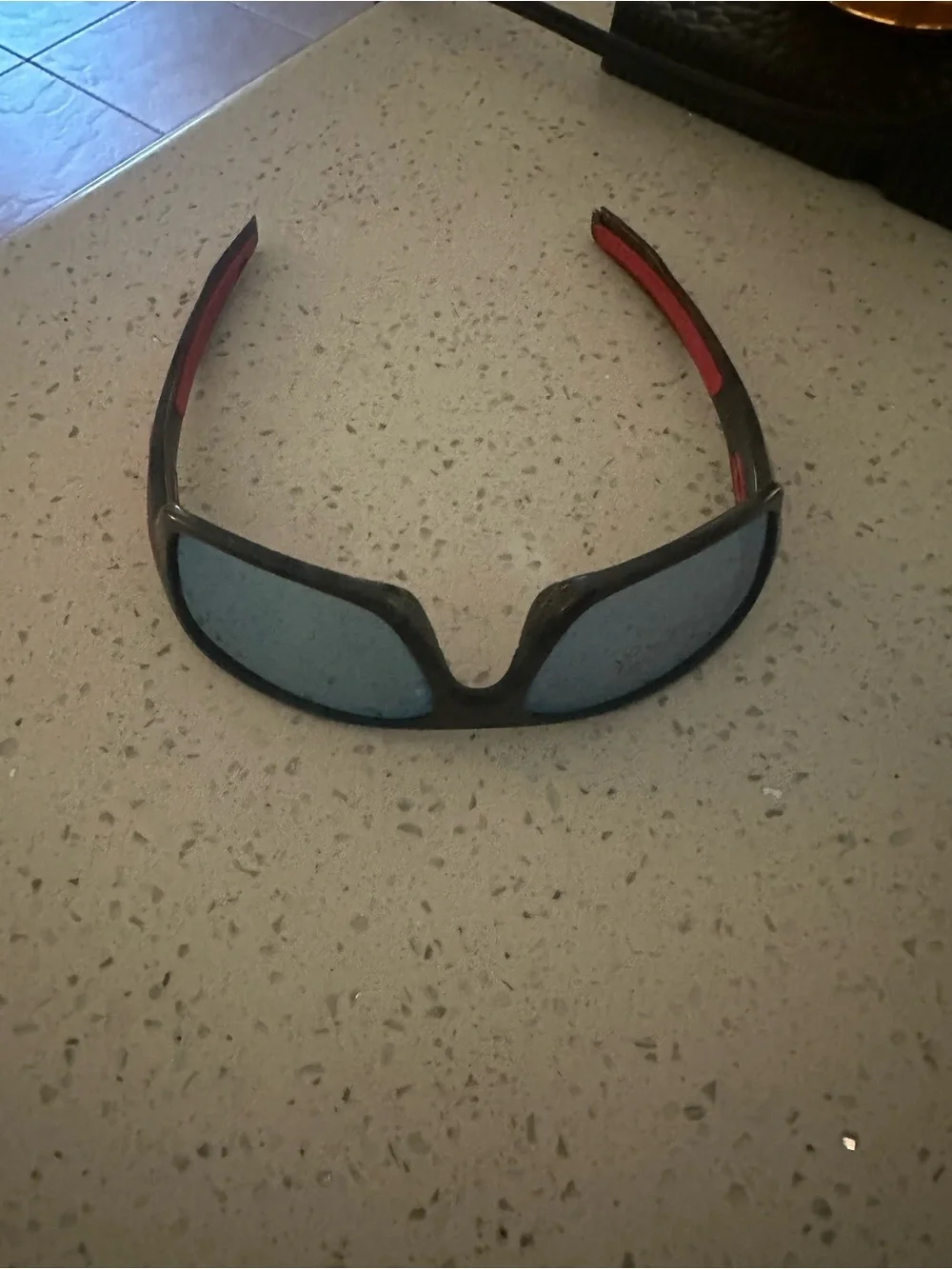 Oakley Polarized Kids Black Frame Sunglasses with Red Temples and Blue Lenses